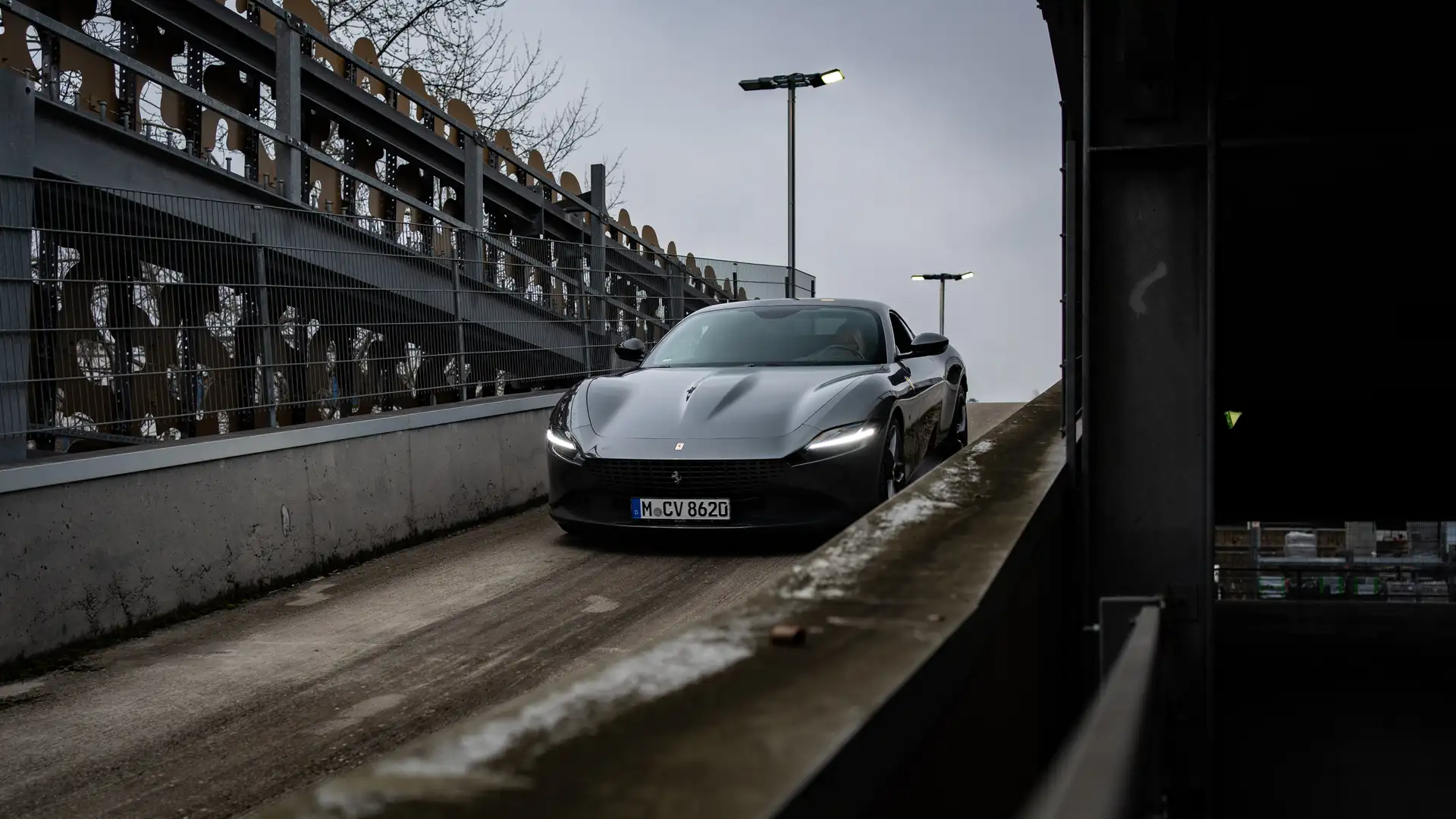 Our Ferrari Roma photographed from the front on a driveway.